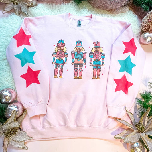 Christmas Themed - Nutcracker with Star Sleeves - Women's Light Pink Sweatshirt